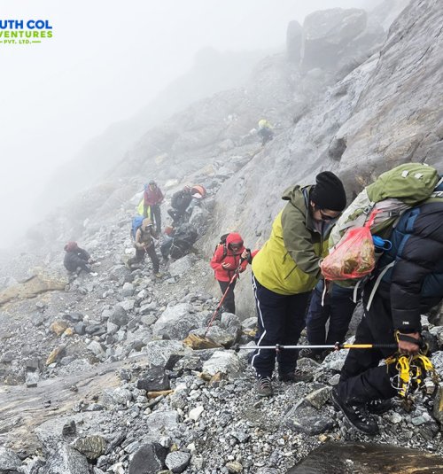 Hiking Through Steeply Rocky Section Towards High Camp Ahead Of Crampon Point