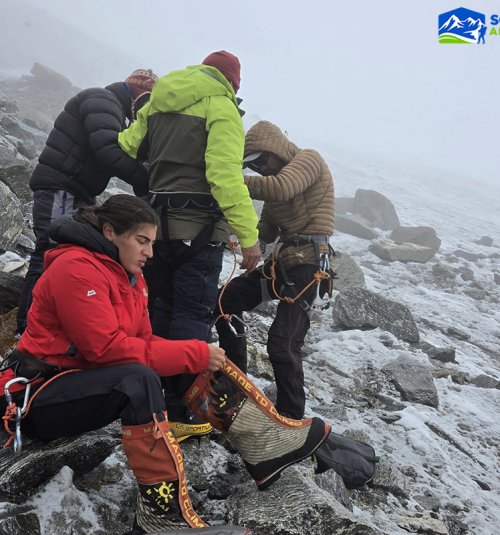 Setting Up Harness And Crampons At Crampon Point While Advancing Toward Mera High Camp