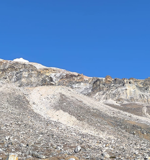 Traversing On Rocky Route During Tengkoma Peak Climbing
